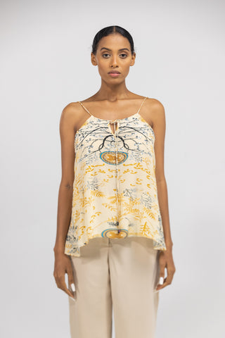 Model wearing the Brisbane Cami Top in luxury silk with yellow and blue prints showcasing premium resort wear style for UAE women.